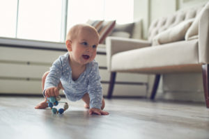 Baby crawling on a newly cleaned floor by ecomaids house cleaning services in Jacksonville.